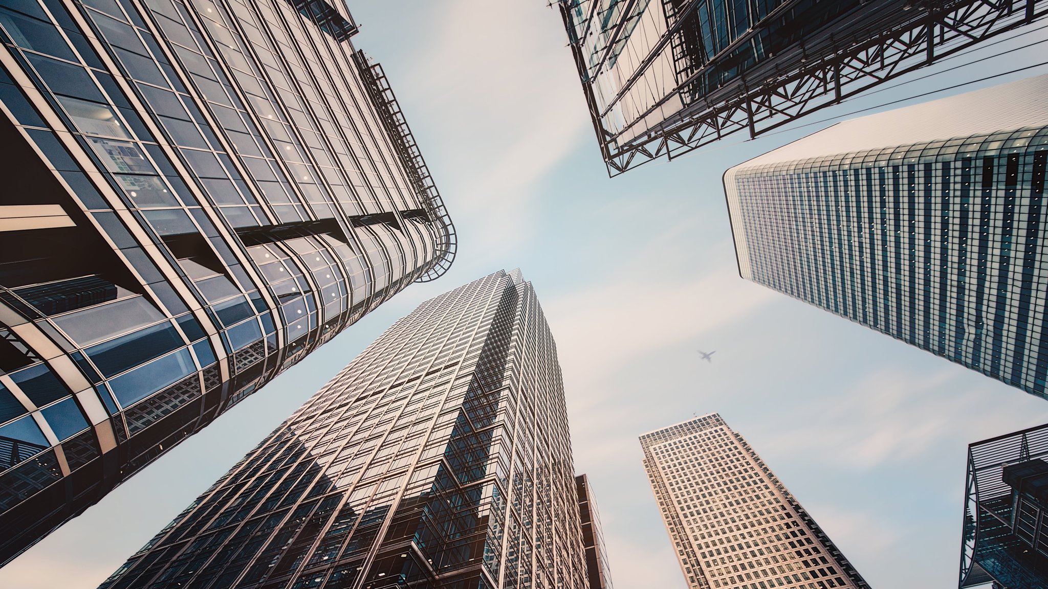 london Skyscrapers, financial district of Canary Wharf london Skyscrapers, financial district of Canary Wharf Modern skyscrapers in business district at sunset - Getty Images